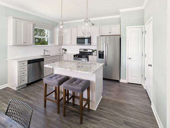 Enjoy cooking meals in the Aspire kitchen with stainless steel appliances.