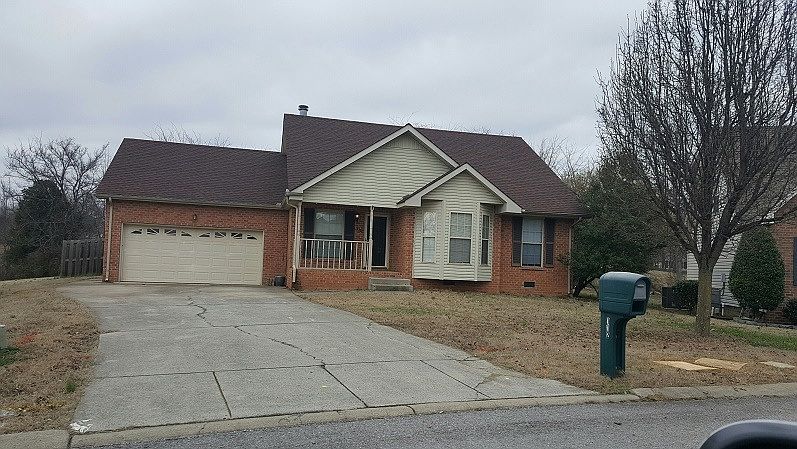 The front of the home with a covered porch.