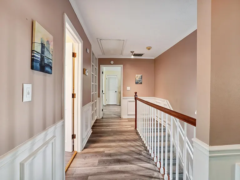 Upstairs Hallway with staircase to Main Level Foyer