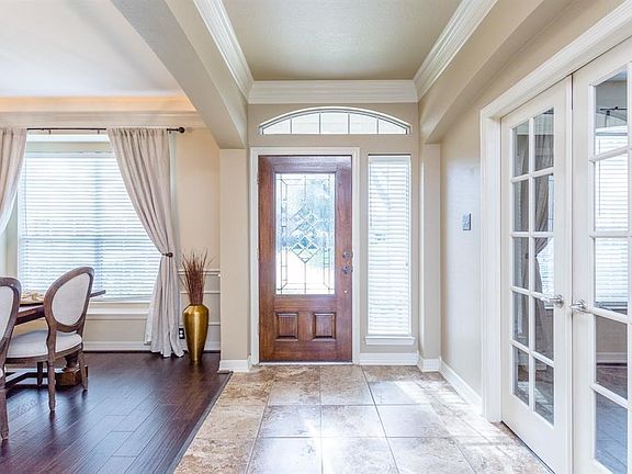 Upon entry guest are welcomed with lots of natural light, and high ceilings with thick decorative crown molding.  The study and formal dining have been upgraded with rich hardwood floors.