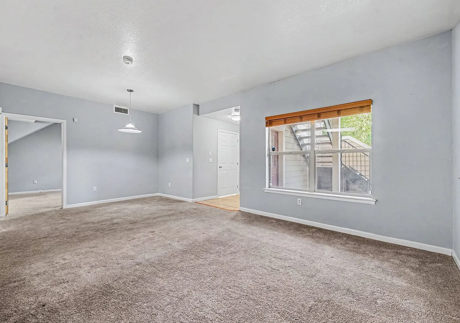 Spacious Ground-Level 2BR/2BA with 1-Car Garage & In-Unit Laundry — Photo 3