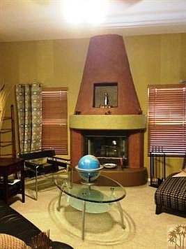 Southwestern Kiva wood burning fireplace in livingroom.