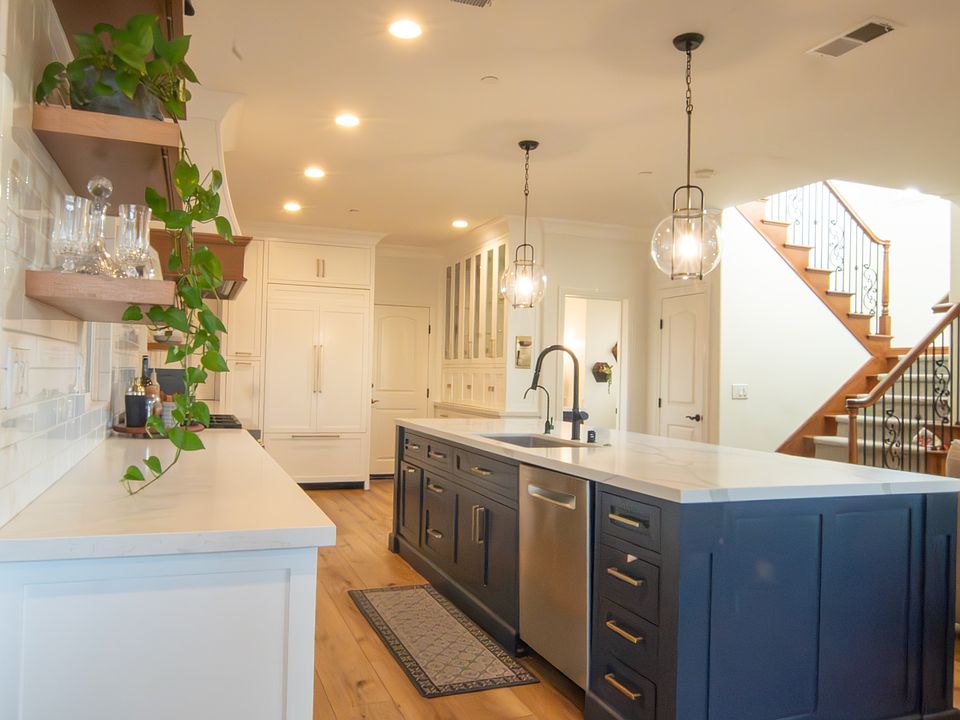 Open concept living. Main floor kitchen, dining and living room.