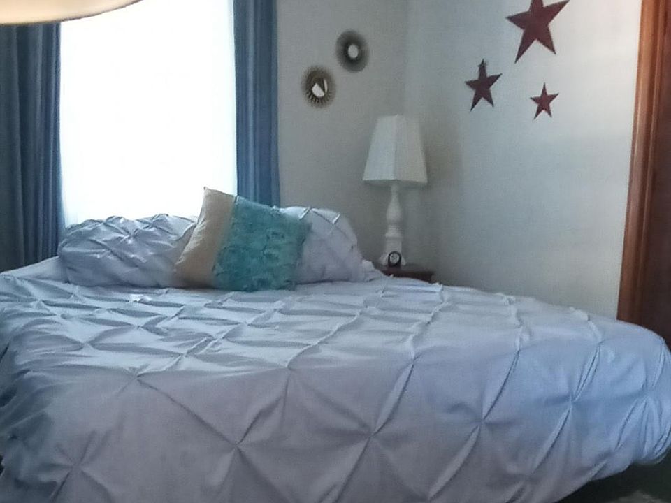 you won't be cramped in this bedroom! King size bed, walking closet and sitting area.