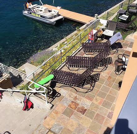 Patio area with chaise lounges.