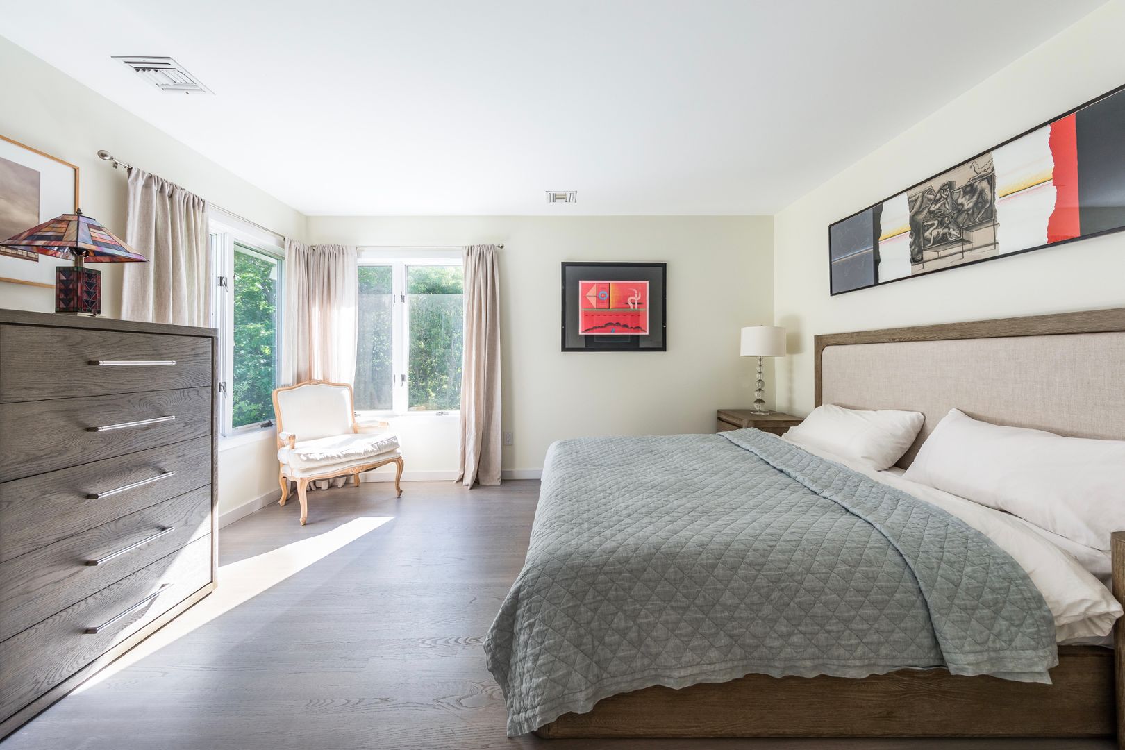  Guest bedroom outfitted with Restoration Hardware furniture and en-suite bathroom. Dresser, closet.