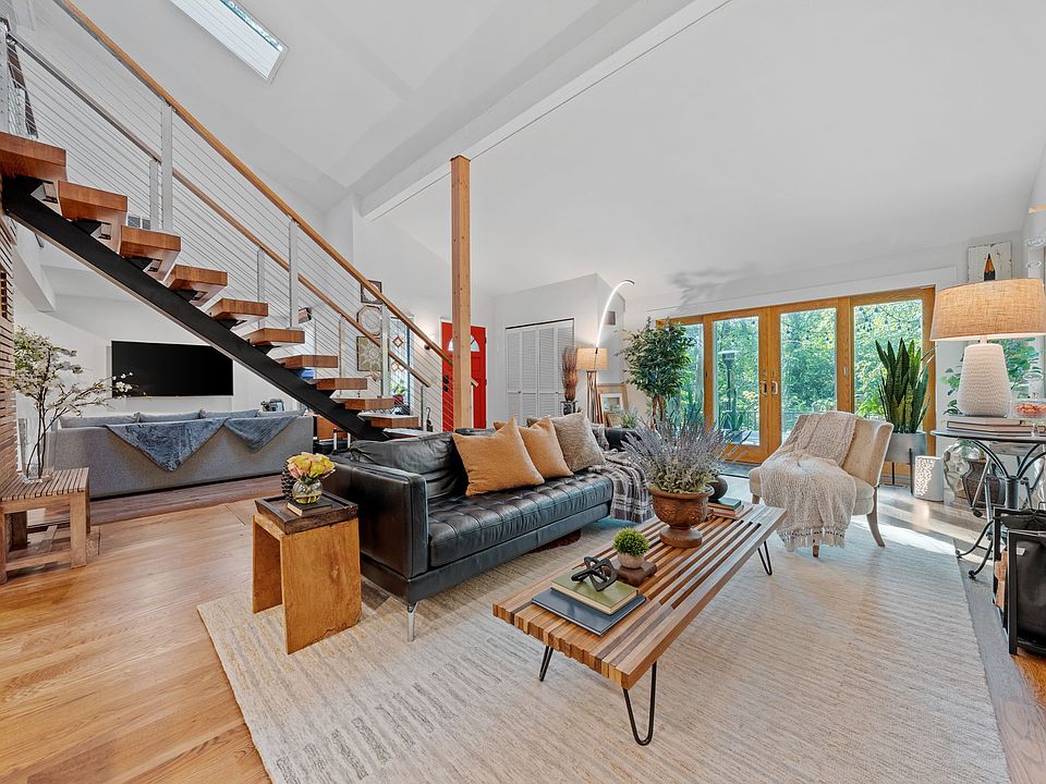 View of stairs and living room from dining room