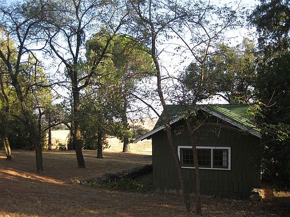 Surrounded by beautiful oak trees.