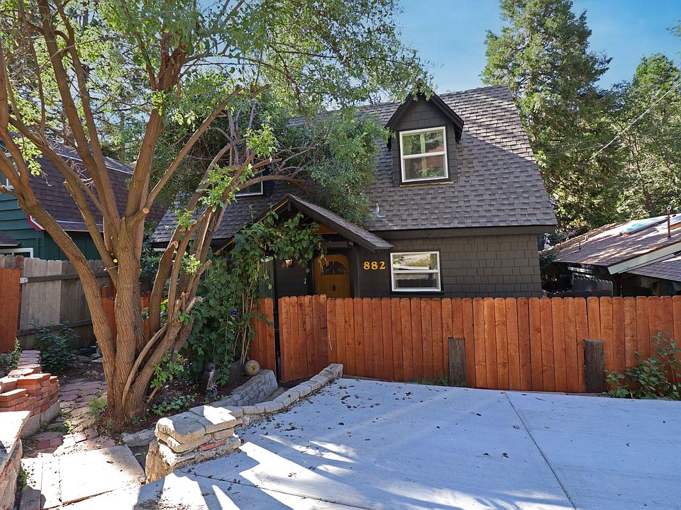 Level entry wth 2 car driveway.