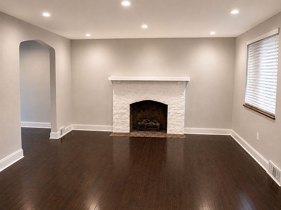 Living room. Hardwood floor and fireplace.