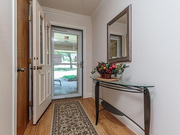 As you will see, the lovely entry way is the beginning of the flowing design of this one story home.