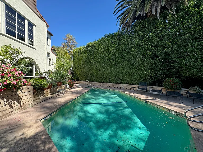 Pool - community pool with mature hedging and sun deck.