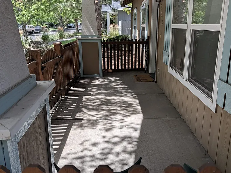 Fully fenced shady front porch