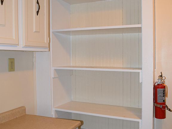 Built in shelving along the wall - great pantry area in kitchen
