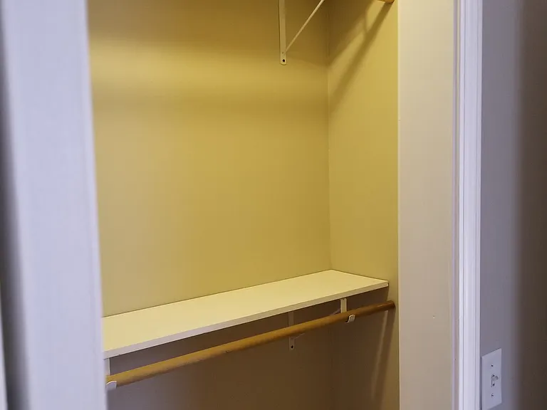 MASTER BEDROOM CLOSET WITH DOUBLE HUNG SHELVES AND RODS