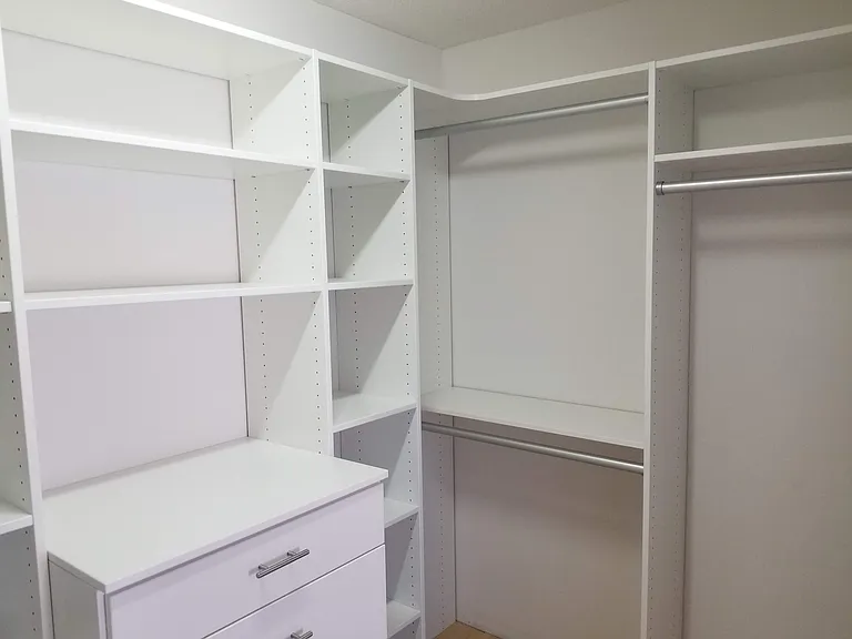 Primary bedroom walk-in closet