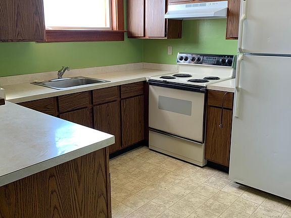 Kitchen with Electric Stove and Fridge