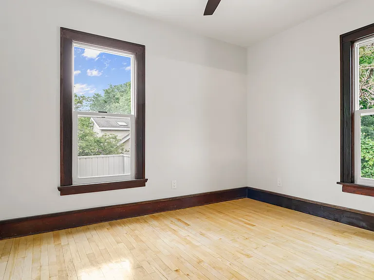 Back bedroom. Bedrooms have ceiling fans!! Helps utility bills and looks good!