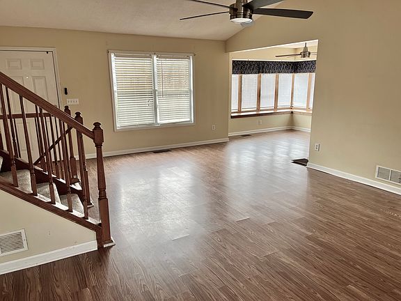 Living room leads to dining room with window seat