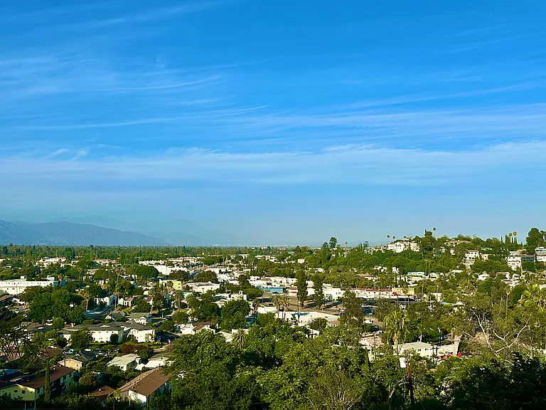 Enjoy the Serene and Beautiful City View under a Shaded Back Patio