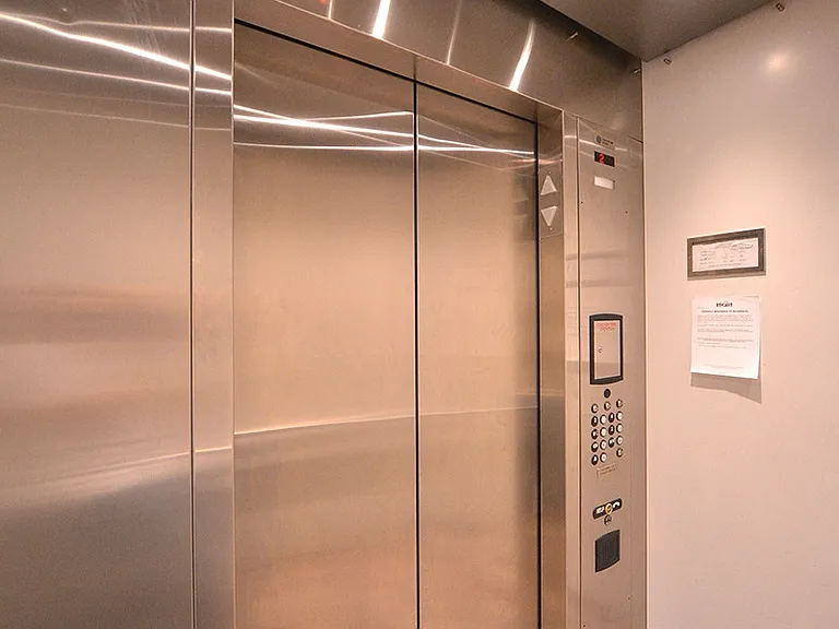 Elevator access to upper level apartments at 12th Street Lofts in National City, California.