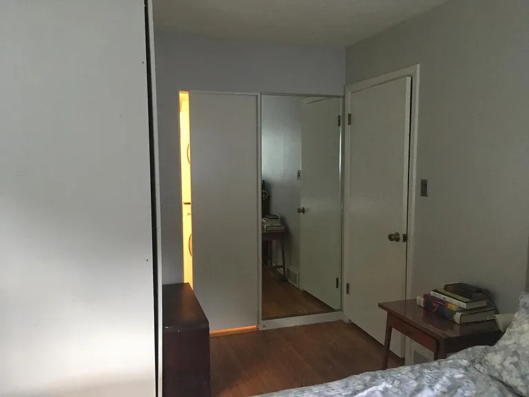 primary bedroom closet, pocket door to bathroom, full-length mirror
