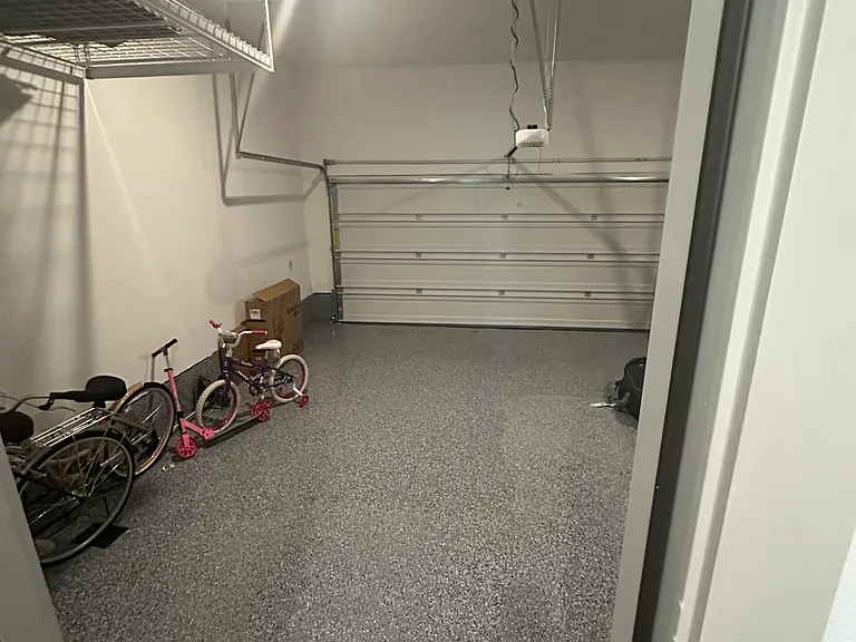 Large two car garage with two side racks for storage