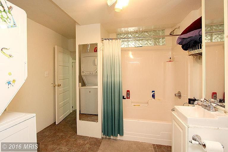 Bathroom with washer and dryer