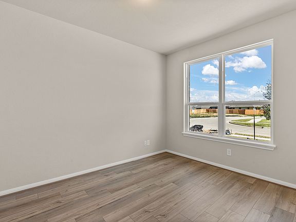 The spacious study offers beautiful floors, large windows and quietly nestled in the front of the ho