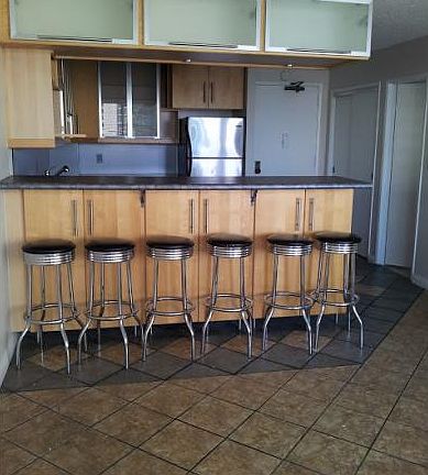 Ample cabinet space above and below the bar.