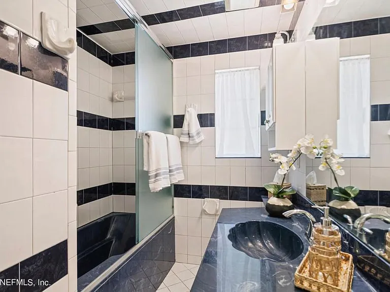 Guest bath with shower/tub. Located in front of the house.