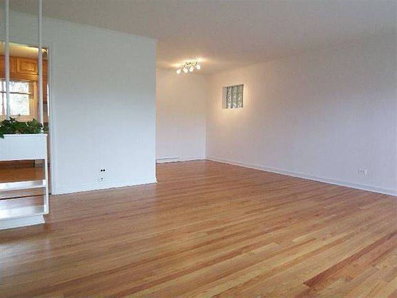 Living with newly refinished oak floors looking to Kitchen and Dining Room