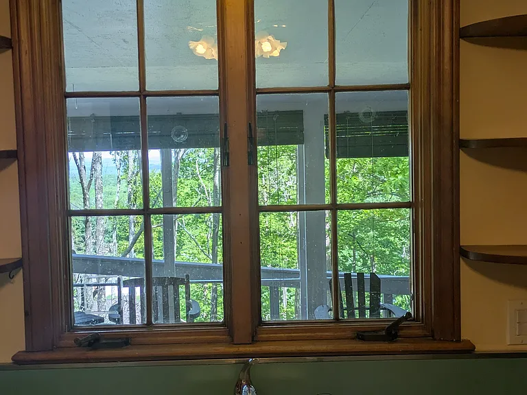 Window leads to screened porch
