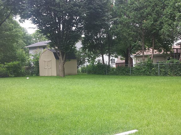 huge fenced yard with shed