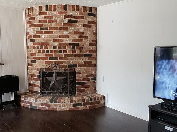 Look at the chimney and the wood floors, such a great combination!