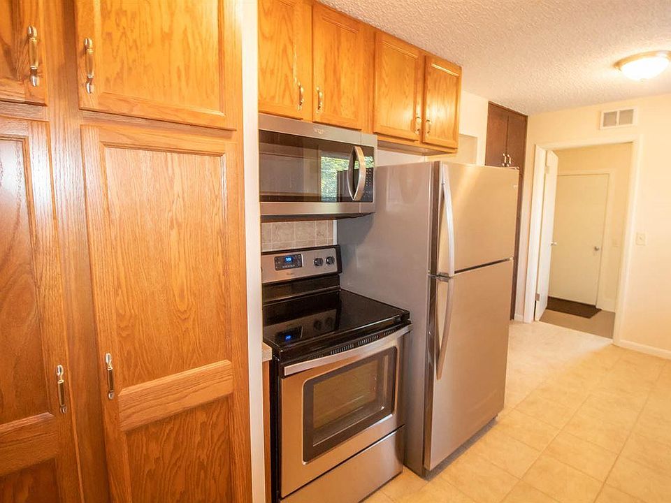 Kitchen is in pristine condition with fridge, stove, microwave & dishwasher.