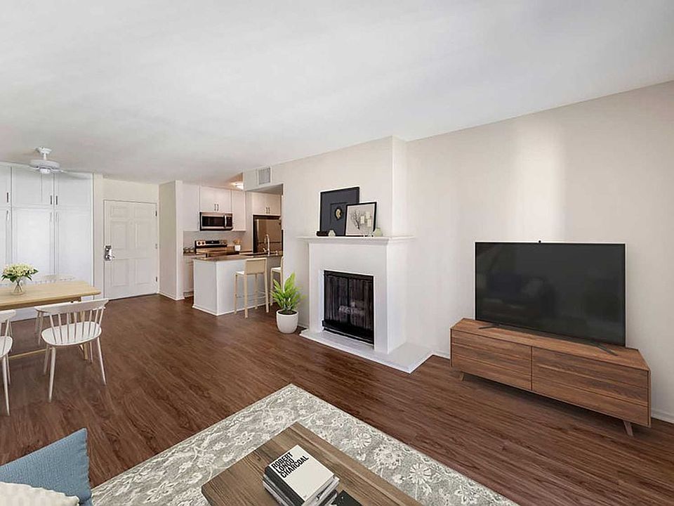 Renovated Package I kitchen, dining, and living area with hard surface flooring