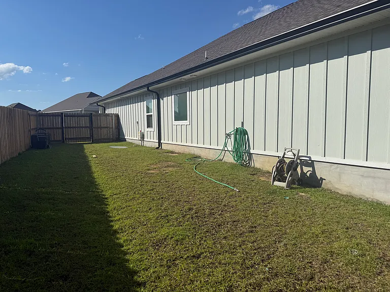 Side of home with gate