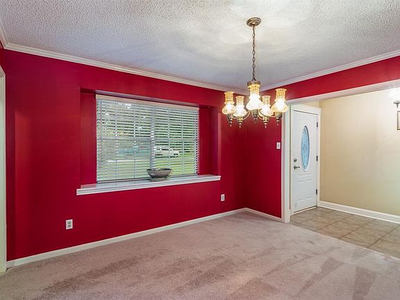 The doorway to the left, leads into the kitchen, to easily serve guests at mealtime.