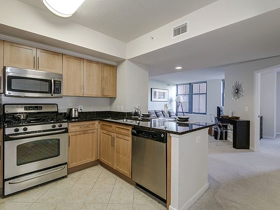 Modern Kitchen with Dishwasher, Disposal, Pantries, and Microwaves