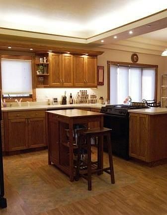 Kitchen - 18 x 12 - The heart of the house with four tier lighting, trey ceilings, expansive oak cab