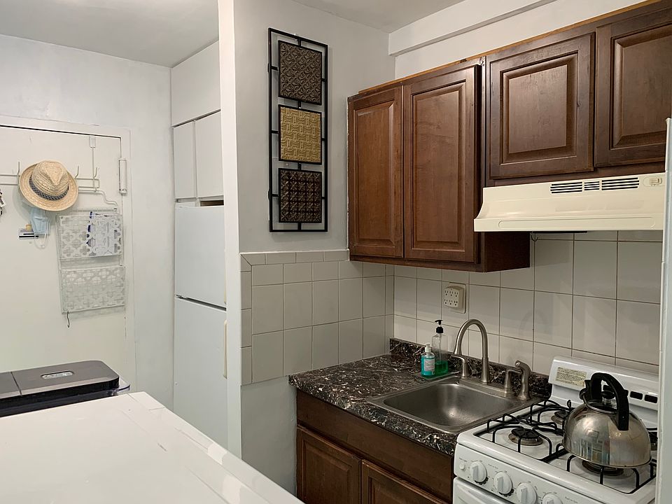 You'll have a normal-size sink so you can wash pots. New kitchen faucet.

Notice the storage space all the way to the ceiling above the white fridge.