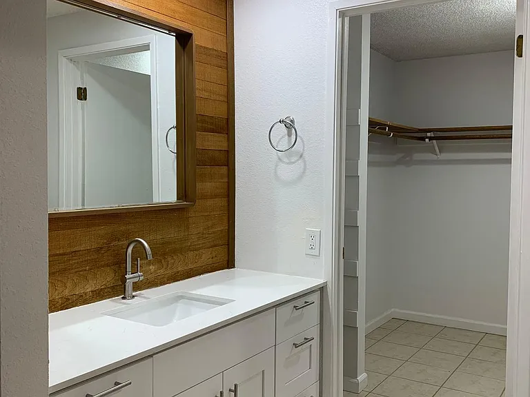 Walk-in closet in primary bedroom.