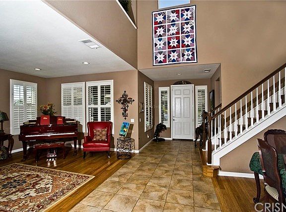 Vaulted ceilings, window shutters, recessed lighting & decorator paint.