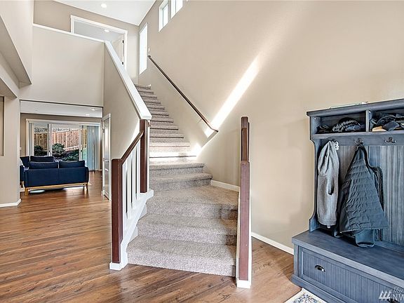 Impressive 2-story entry with laminate flooring that extends through the main living areas. 