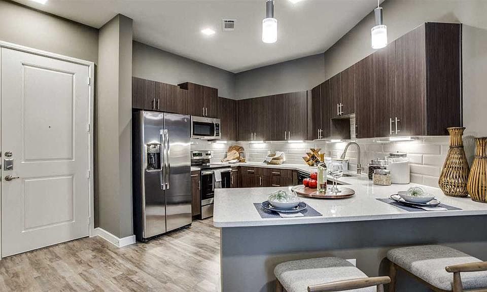 Spacious eat in kitchen with stainless steel appliances.