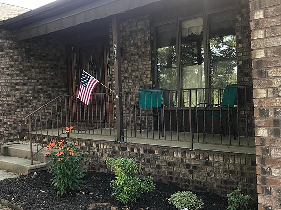 Lovely front porch with a retractable awning!