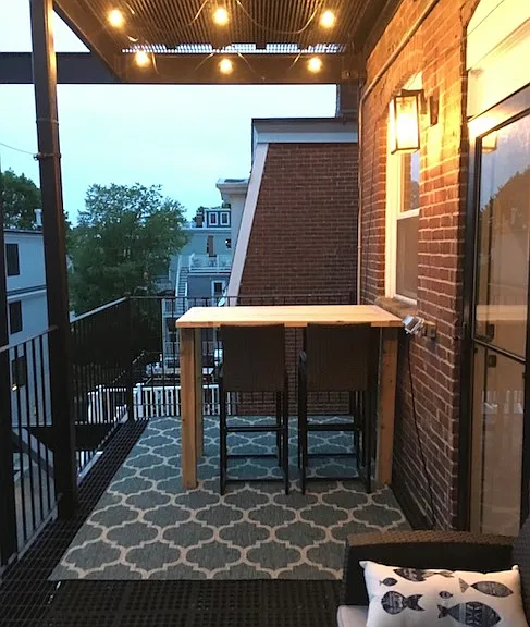 Private oversized deck with harbor and Blue Hills views, perfect for a morning coffee or evening dining.