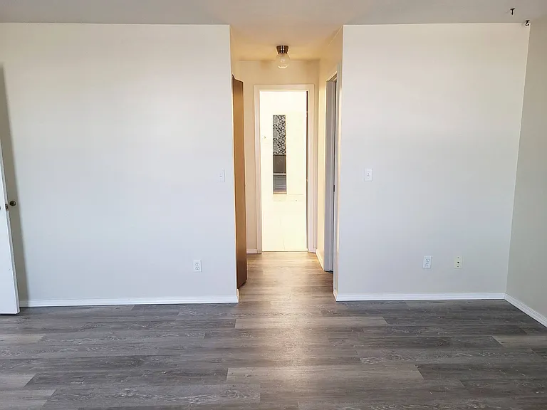 Living room and hallway in a unit at Francis Villas.