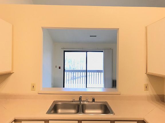 View from kitchen sink into living room 